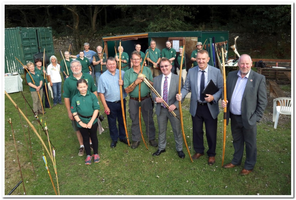 From right to left in the foreground of the photograph would be Councillor Rob Jones ( Margam Ward), Paul Hinder ( Project Development and Funding Manager), Mr. Murray Patterson of 'Glennmont Partners' (Biomass/Margam Green Energy), the Chairman of the Margam Archers Dave Hughes, Councillor John Rogers ( Taibach Ward), David Cook , Secretary of the Margam Archers Club.